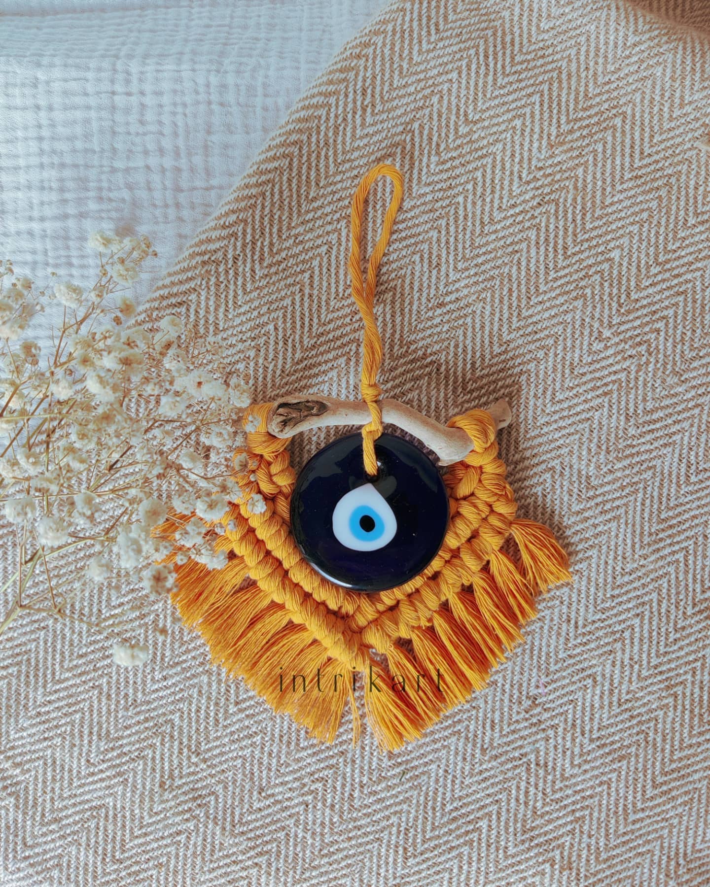 Mustard yellow mini evil eye macrame wall hanging