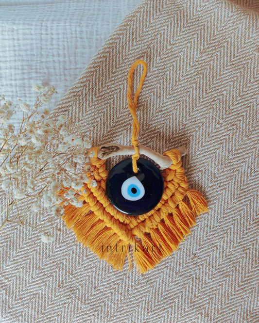 Mustard yellow mini evil eye macrame wall hanging