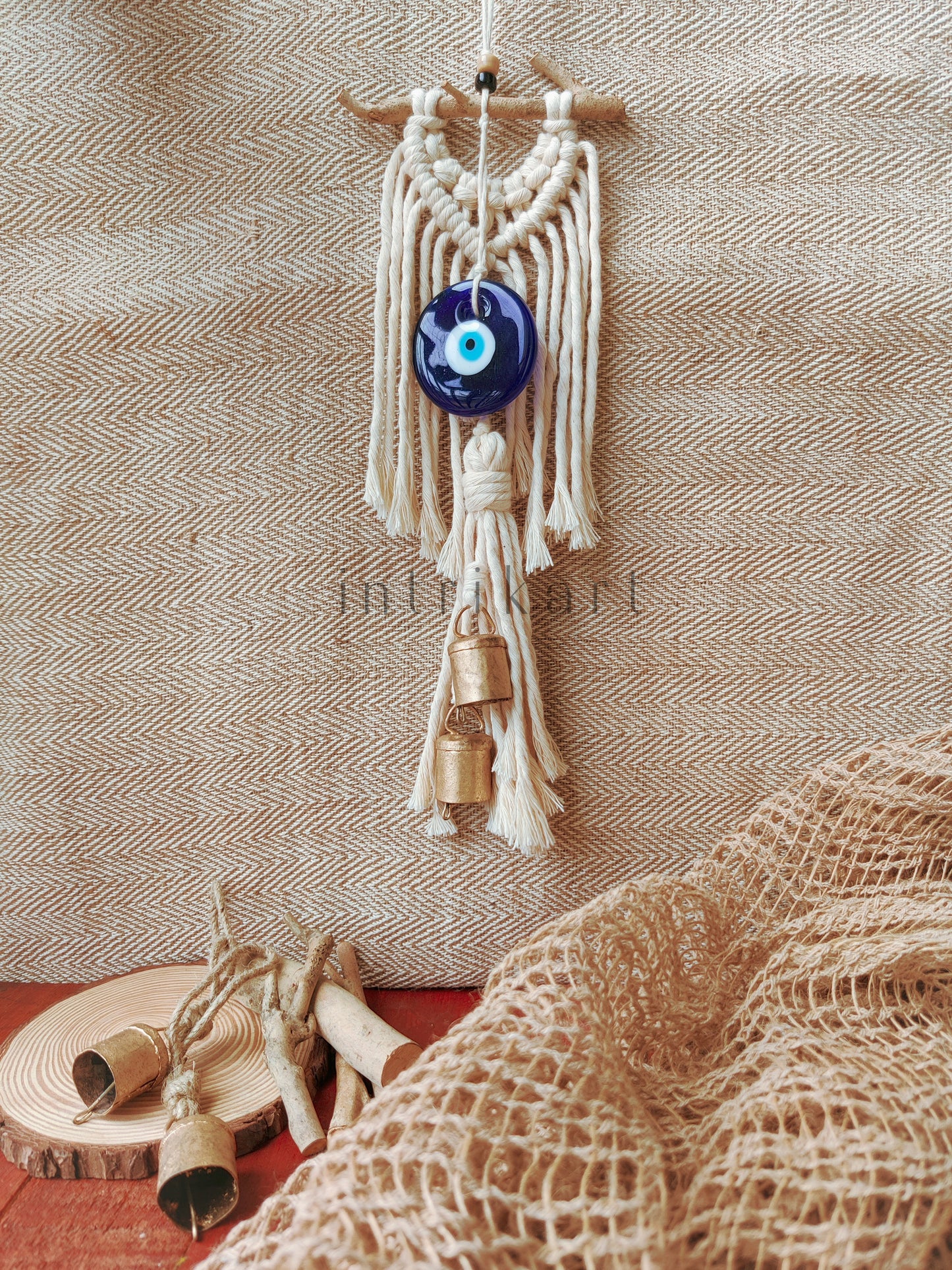 Evil eye cow bell macrame wall hanging