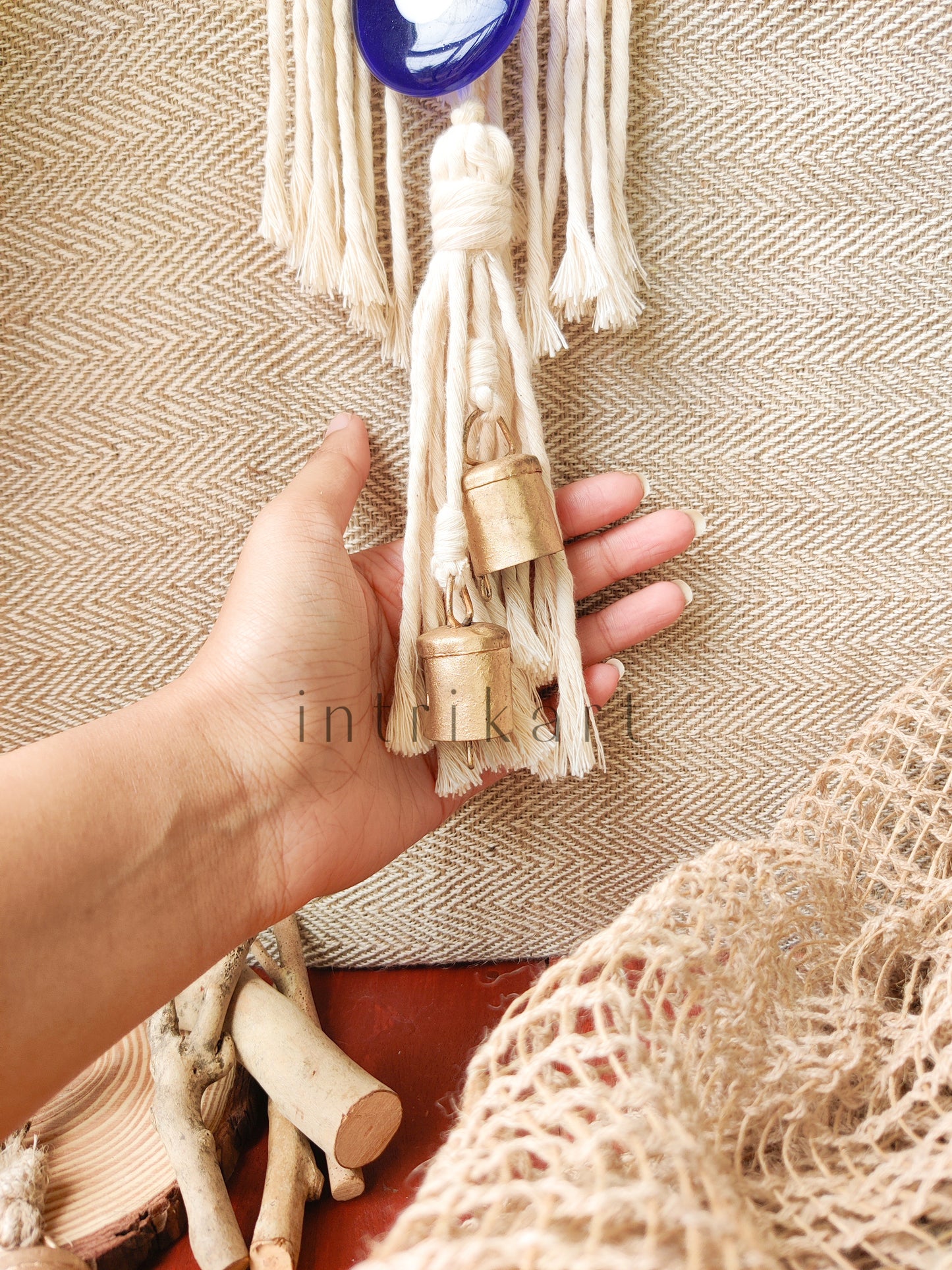 Evil eye cow bell macrame wall hanging