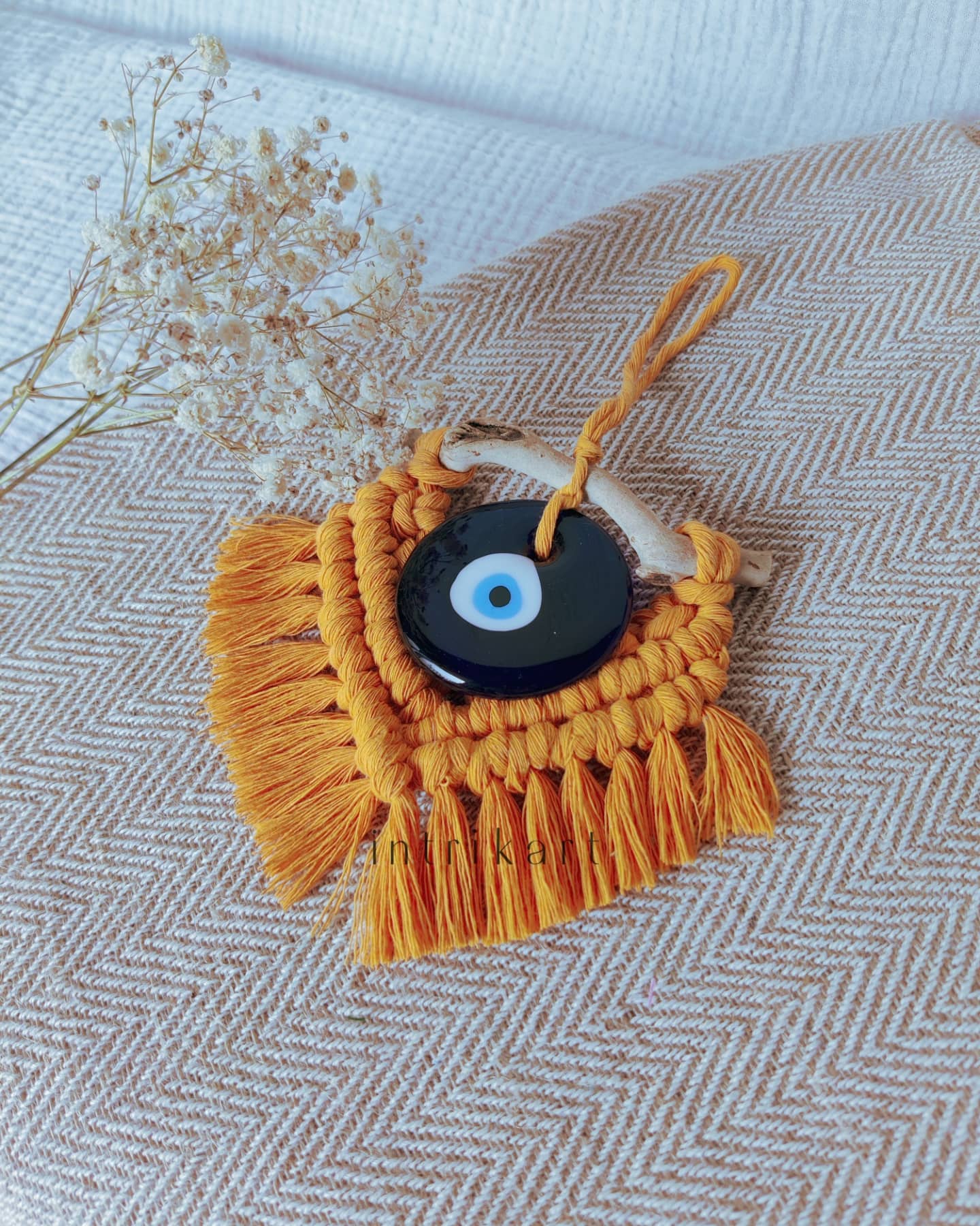 Mustard yellow mini evil eye macrame wall hanging