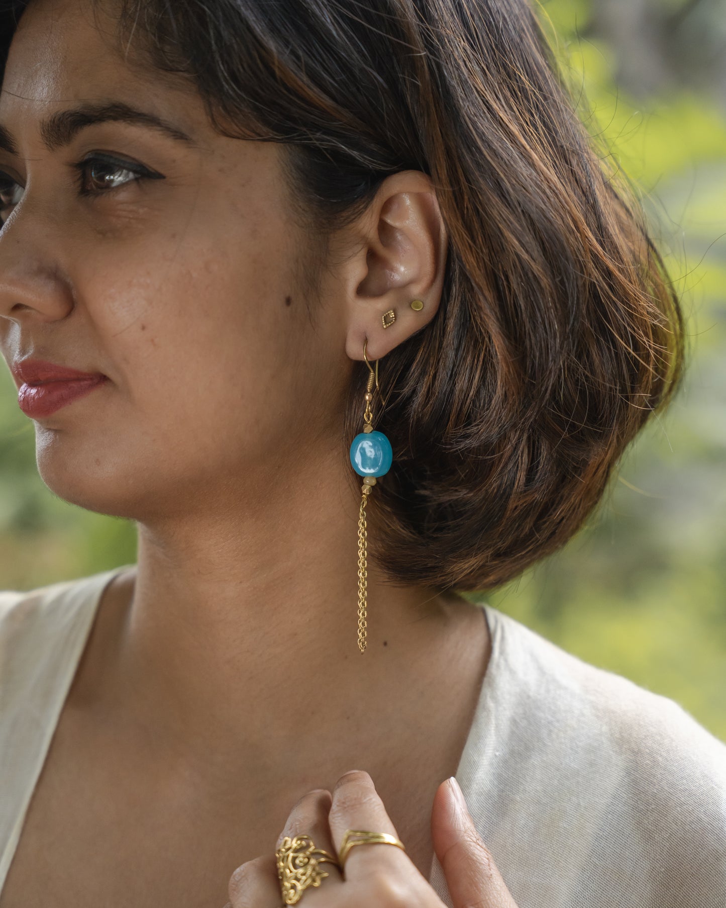 Neeli blue bead brass earrings