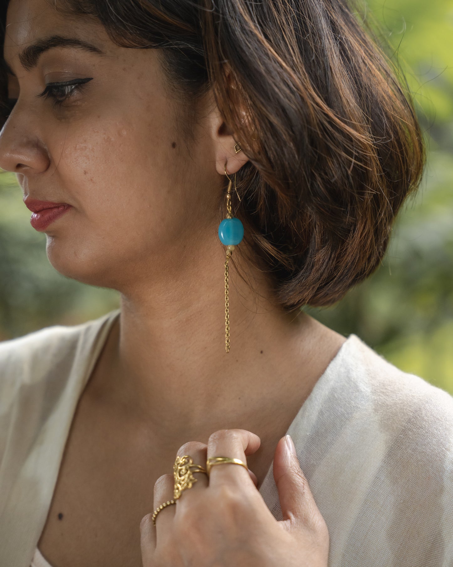 Neeli blue bead brass earrings
