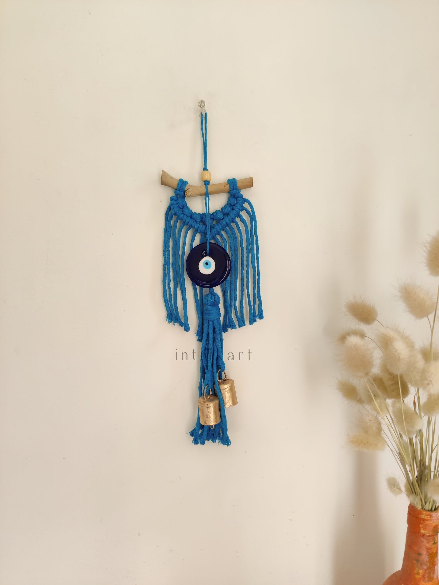Evil eye cow bell macrame wall hanging